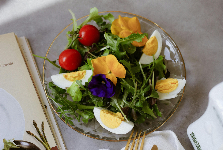 Fresh edible flowers on healthy meal