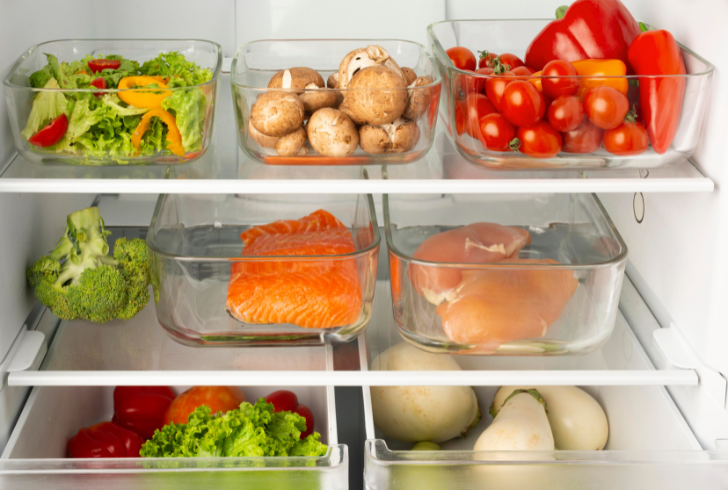 Open refrigerator with organized shelves